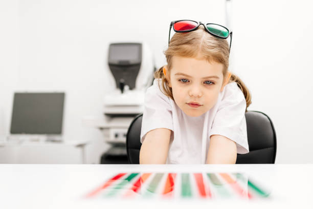 A modern approach to orthoptic therapy for comfortable vision treatment in children. A cheerful girl wearing vision stimulation glasses highlights the importance of an engaging restoration process.
