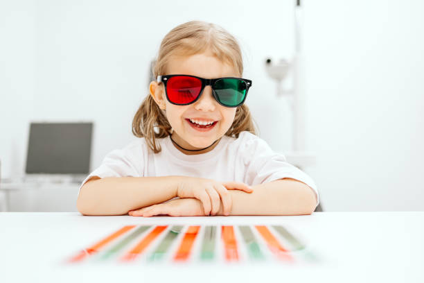 istock A modern approach to orthoptic therapy for comfortable vision treatment in children. A cheerful girl wearing vision stimulation glasses highlights the importance of an engaging restoration process. 2175598041