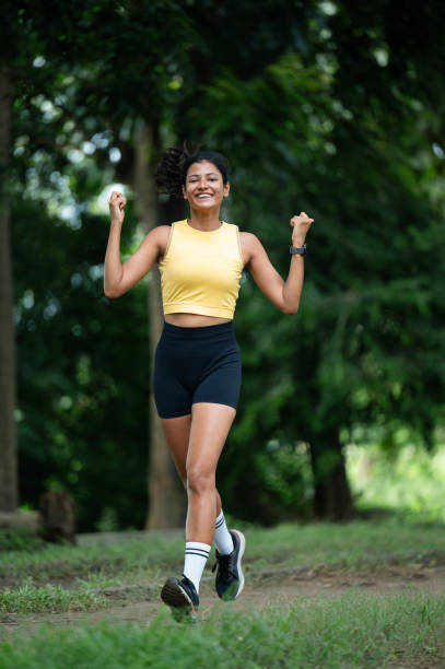 istock Joyful Woman Exercising Outdoors in the Park 2175598596