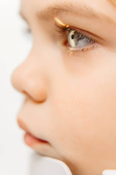 Close-up of a cute baby girl isolated over white background