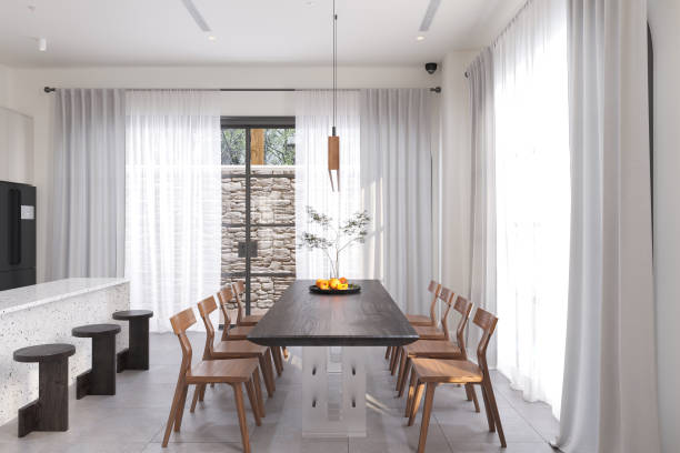 istock Scandinavian-Inspired Dining Room with Minimalist Design and Natural Light 2175599545