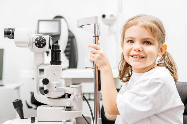 istock Close-up of a little girl with deep eyes undergoing vision diagnostics using a slit lamp in an ophthalmology clinic. A perfect moment highlighting the importance of caring for children's vision. 2175599582