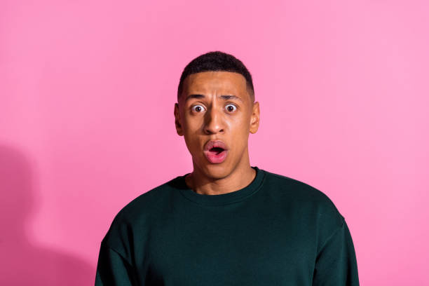 istock Photo of impressed shocked guy dressed pullover big eyes emtpy space isolated pink color background 2175603955