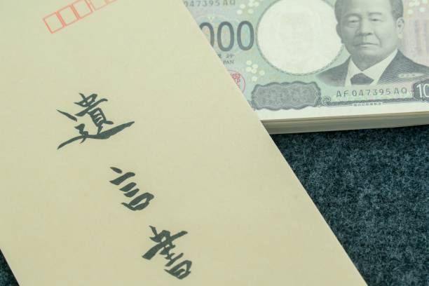 istock A will and a stack of bills. The envelope has the word 