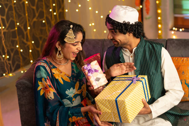 istock Man giving gifts to wife while celebrating Eid-Ul-Fitr 2175606308
