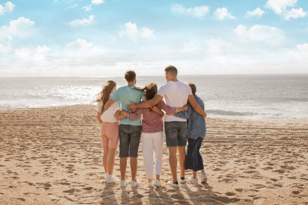 istock Families enjoying a sunny beach day while embracing the ocean view together 2175607019