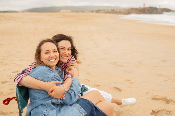 istock Friends enjoying a warm beach day together on a sunny afternoon 2175607046