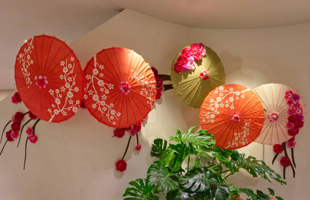 istock Beautiful paper umbrellas decoration on the wall 2175607149