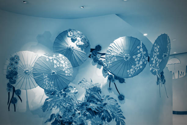 Beautiful paper umbrellas decoration on the wall, objects background