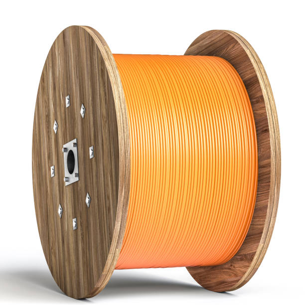 istock Wooden cable reel with orange cable on white background 2175607886