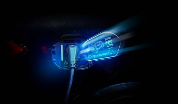 istock Power cable pump plug in charging power to electric vehicle EV car. 2175608042