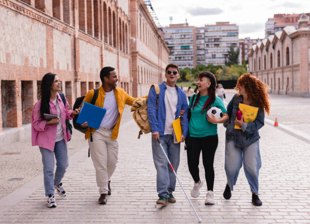 istock Diverse Group of College Students Walking Outdoors and Laughing 2175608305