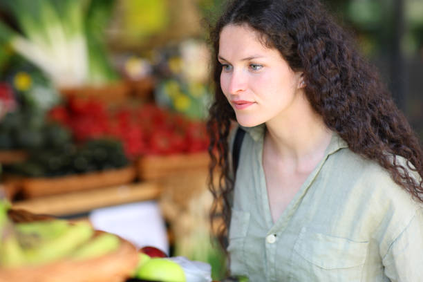 Client in a greengrocery looking at products