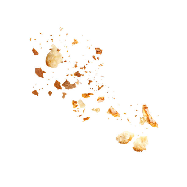 istock Flying Bread Crumbs isolated. Scattered Bread Crumbs Explosion on white background. 2175609880