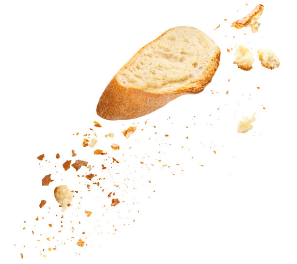 istock Flying Bread Crumbs isolated. Scattered Bread Crumbs Explosion with Cutting slices of wholegrain wheat bread on white background. 2175609898
