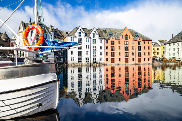 4th April 2022 Alesund Norway - Lovely sunny day in Alesund harbour city old town Scandinavian architecture Norway Northern Europe
