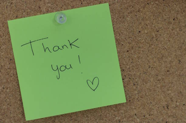 istock a thank-you note pinned to a cork board 2175615541