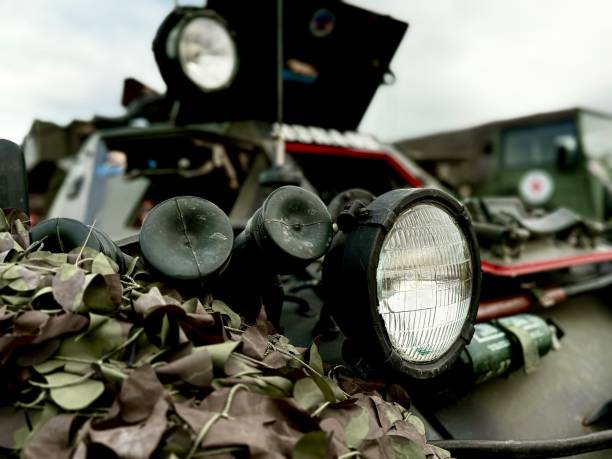 istock An army vehicle headlight with camouflage 2175615680