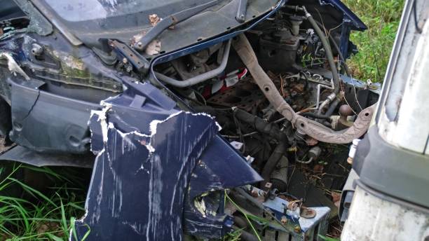 istock Broken Damaged Minivan Car Wreck Abandoned on Scrapyard For Recycling 2175620186
