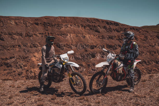 istock Two motocross bikers sitting on their bikes and looking at the camera 2175620898