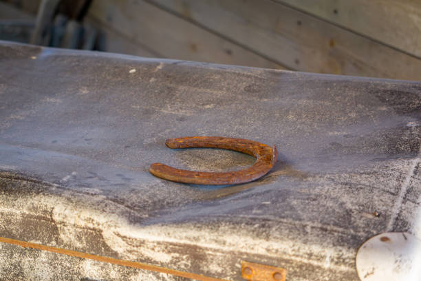 a rusty old horse shoe lying on a wooden box