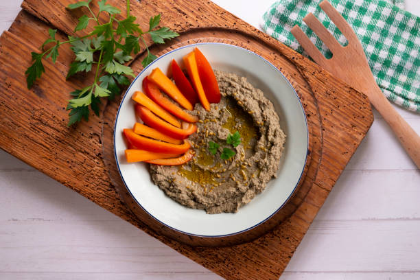 istock Lentil hummus with carrot and pepper crudites. Top view table with decorations. 2175636682