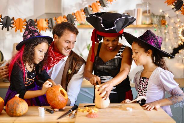 istock Happy family preparing decorations for Halloween 2175636971