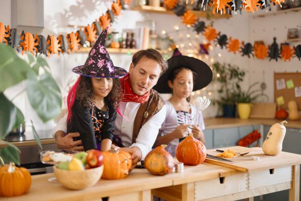 istock Father doing Halloween preparations with his two little girls 2175637025