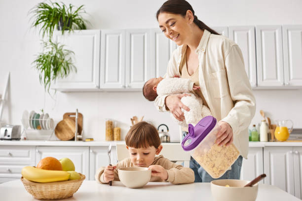 istock A joyful young mother preparing breakfast in a bright kitchen with her two little sons 2175637752