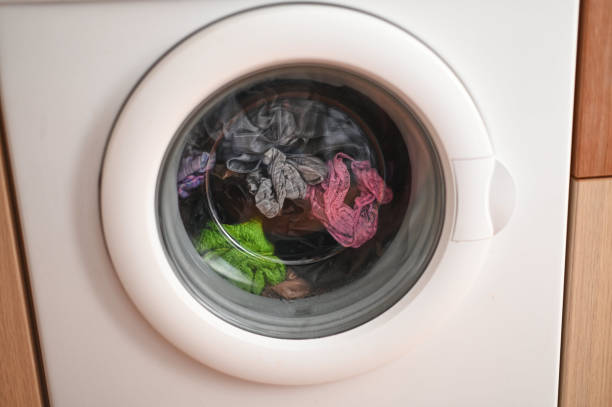 istock a washing machine in operation washing dirty clothes 2175639689