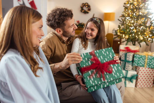 istock Heartwarming Christmas gift exchange at home 2175640034