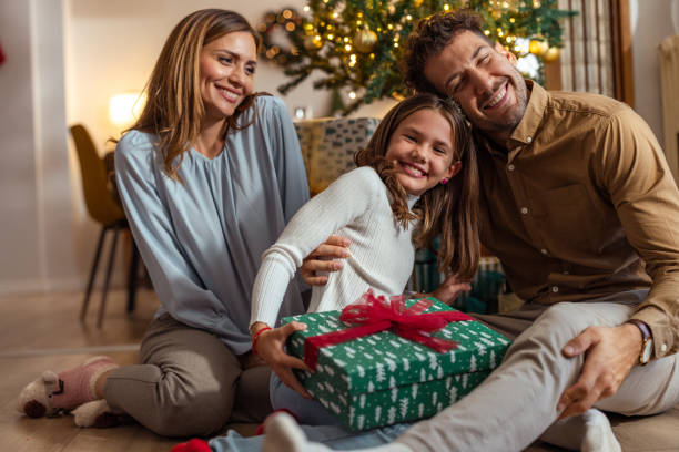 istock A family Christmas moment by the tree 2175640281