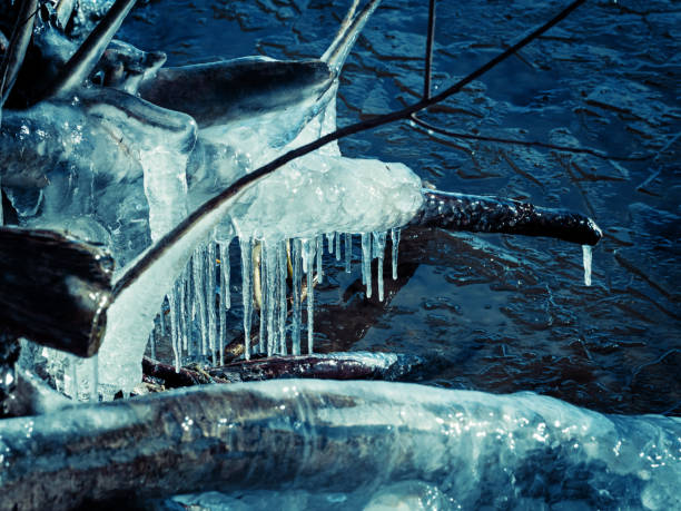 Icicle, dirty ice stalactite sharpened downward when melting dirty snow