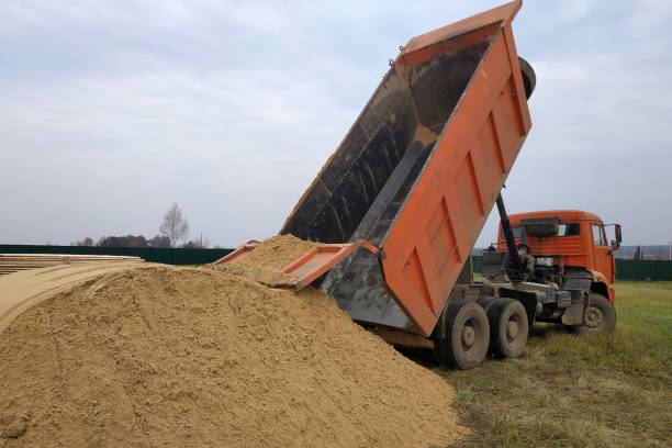 istock A large orange dump truck unloads the sand 2175644772