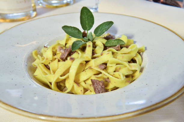 istock Fettuccine pasta con salvia e funghi is a typical egg pasta made in Italy 2175644930