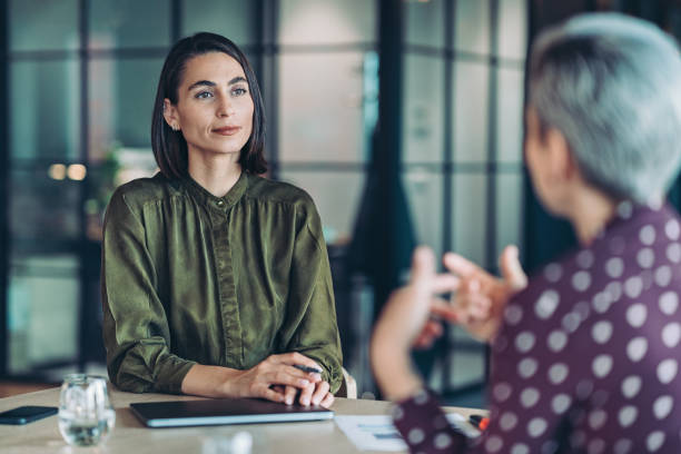 istock Two businesswomen talking on a meeting 2175651645
