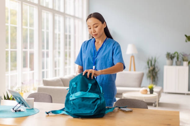 istock Healthcare worker prepares for work in bright room 2175652893