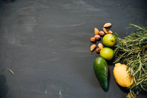 Cropped shot of young Asian woman grocery shopping for fresh avocados along the produce aisle. Routine grocery shopping trip, reflecting the concept of a healthy eating lifestyle.
