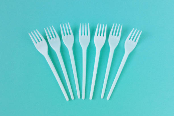 istock Seven white plastic forks on a turquoise background. Top view. 2175655477