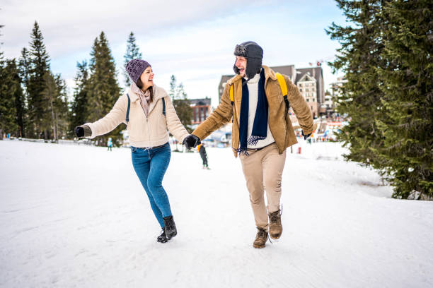 istock Couple running outdoors in snow 2175656041