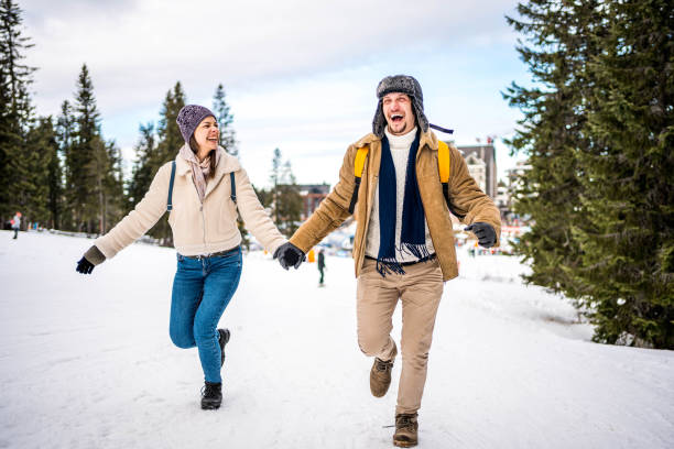 istock Couple running outdoors in snow 2175656665