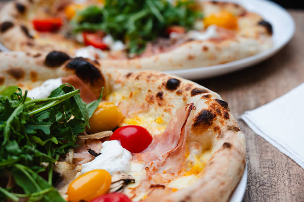 istock Gourmet pizza with arugula and cherry tomatoes 2175658014
