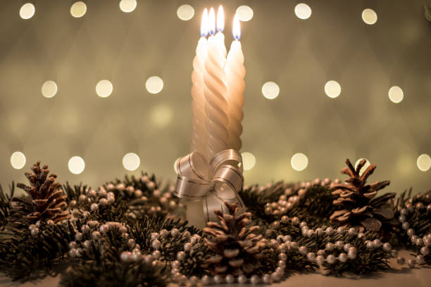 Christmas decoration with candles and holiday lights.