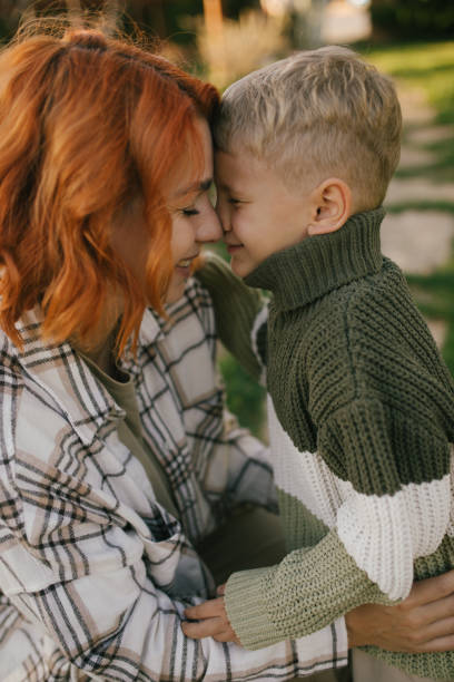 istock Happy mother and her son having fun spending time together outdoors. 2175659996