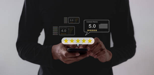 istock Customer Review, Young Man hand using smartphone mobile touch five star to review and give 5 stars with very good results in service, Good review 5 star rating choice feedback 2175660901