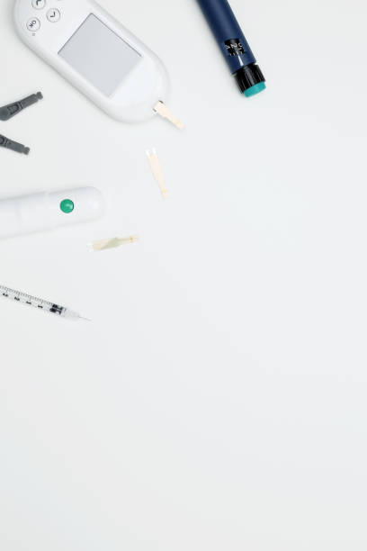 istock Diabetes concept with glucometer, syringe pen with insulin, blood test strips. Concept of worldwide diabetes awareness. Top view. Copy space 2175661699