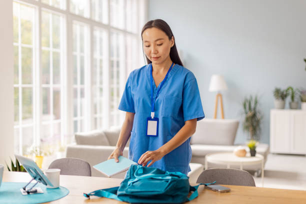 istock Nurse organizes bag for the day amid cozy setting 2175661880