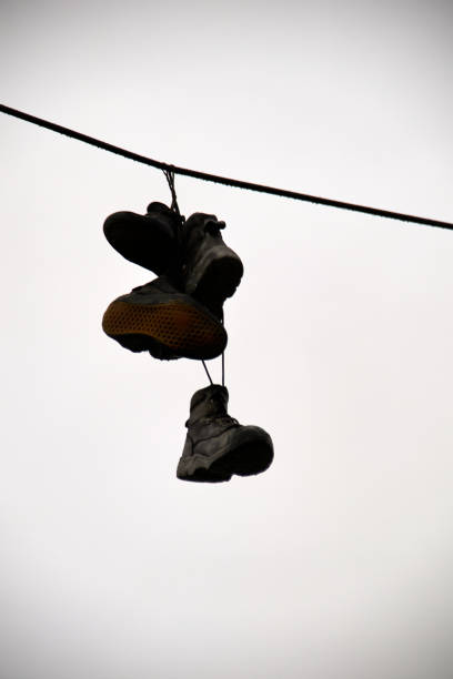 Shoes on a telephone line.