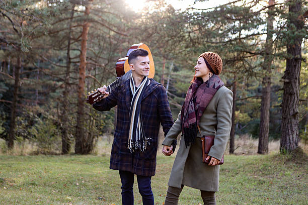 Young couple in nature. Both about 25 years old, Caucasian people.