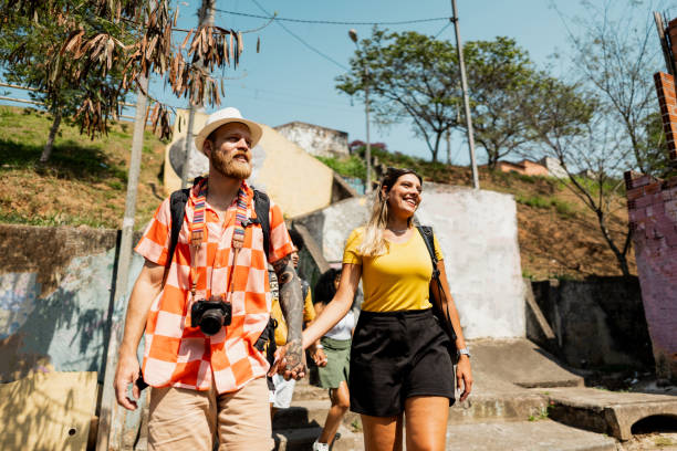 istock Traveler couple walking in a favela, Brazil 2175665502